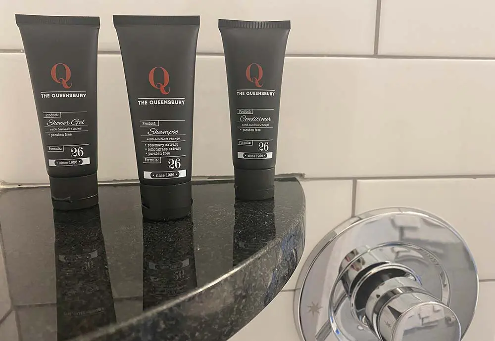 shower and conditioner bottles in shower