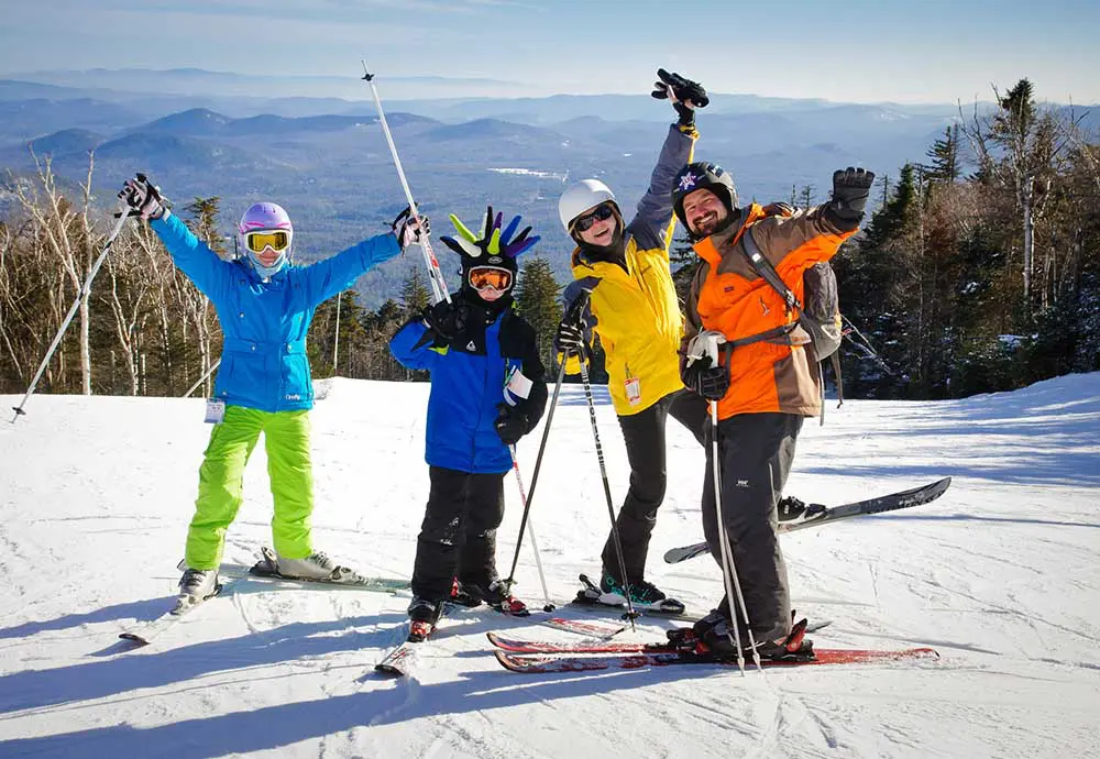 Skiers Family on slope posing for photo